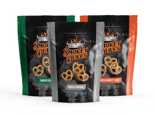 Six bags of Smokey Dukes pretzels, 2 bags of each of our current flavors: original (x2), Midwest spicy (x2), and dill (x2).